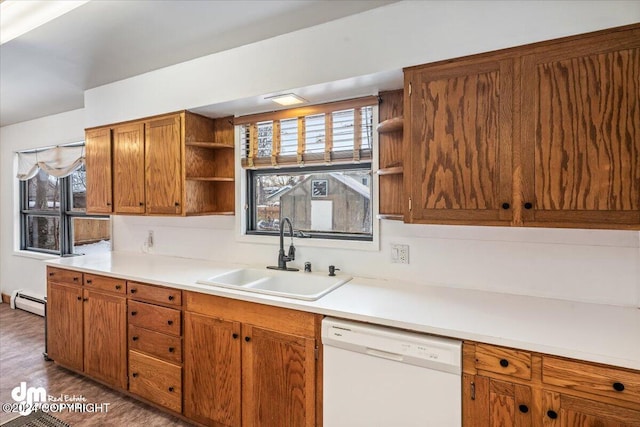 kitchen with baseboard heating, sink, white dishwasher, and dark hardwood / wood-style floors