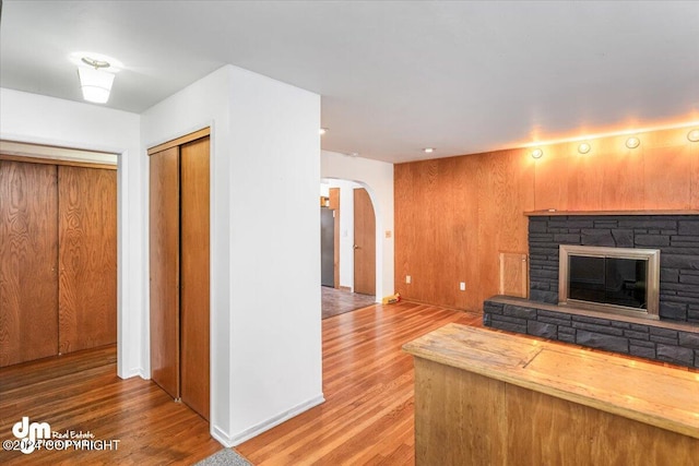 unfurnished living room featuring a fireplace and hardwood / wood-style floors