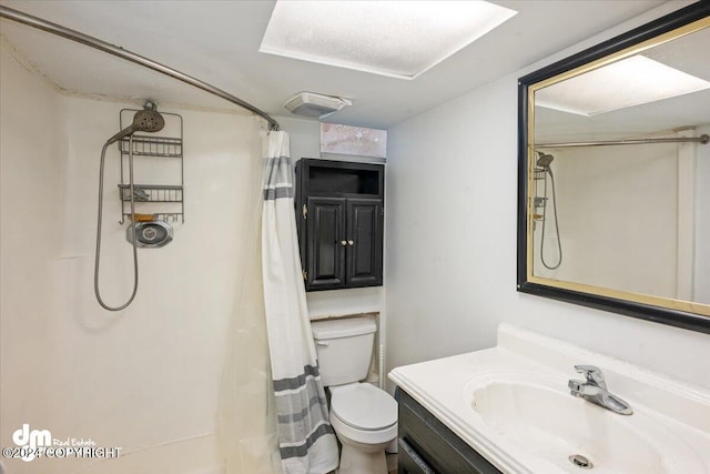 bathroom with vanity, toilet, and walk in shower