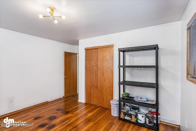 bedroom with dark wood-type flooring