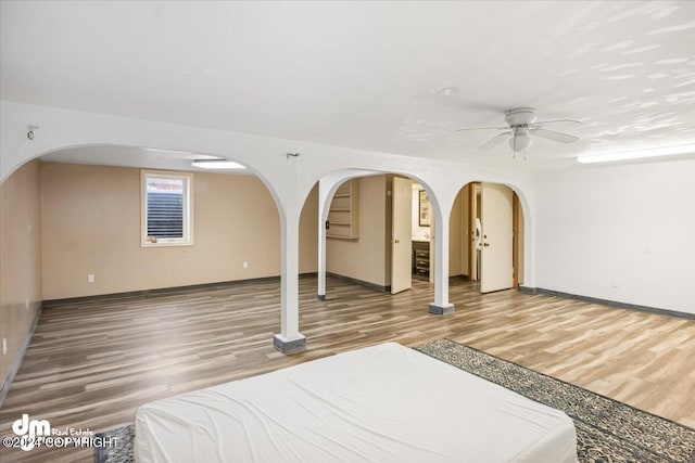 empty room featuring ceiling fan and hardwood / wood-style flooring