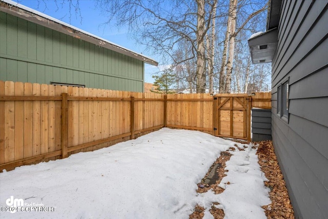 view of yard layered in snow