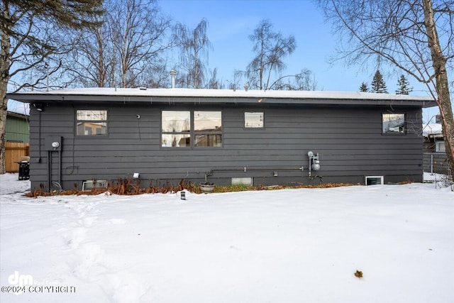 view of snow covered house