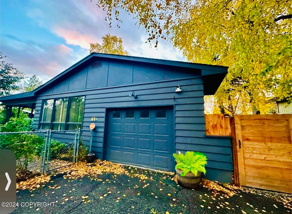 property exterior at dusk with a garage