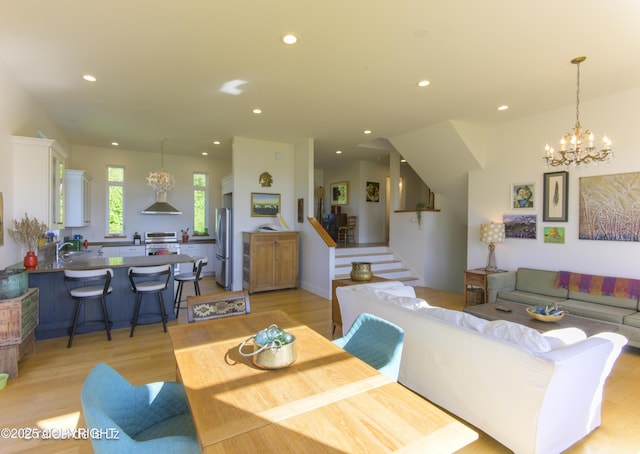 4760 Craftsman Rd, Homer, AK 99603 - living area featuring recessed lighting, light wood-style flooring, a chandelier, and stairway