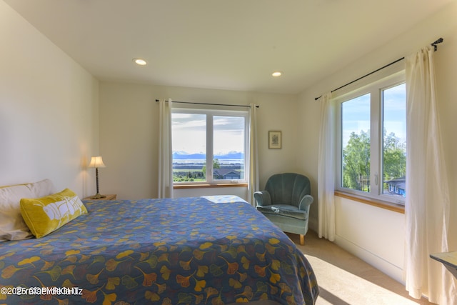 4760 Craftsman Rd, Homer, AK 99603 - bedroom featuring multiple windows, light carpet, and recessed lighting