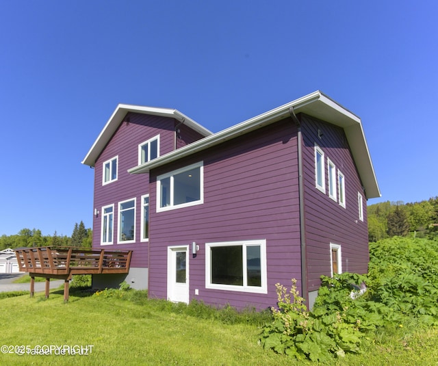 4760 Craftsman Rd, Homer, AK 99603 - back of property with a deck and a lawn
