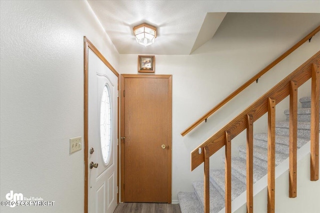 entrance foyer with hardwood / wood-style floors