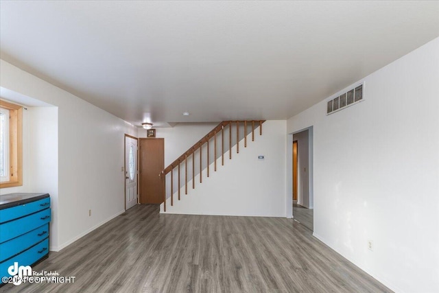 unfurnished living room featuring light wood-type flooring