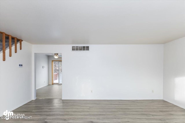 empty room featuring light wood-type flooring and ceiling fan