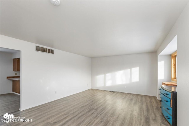 unfurnished living room with light hardwood / wood-style floors