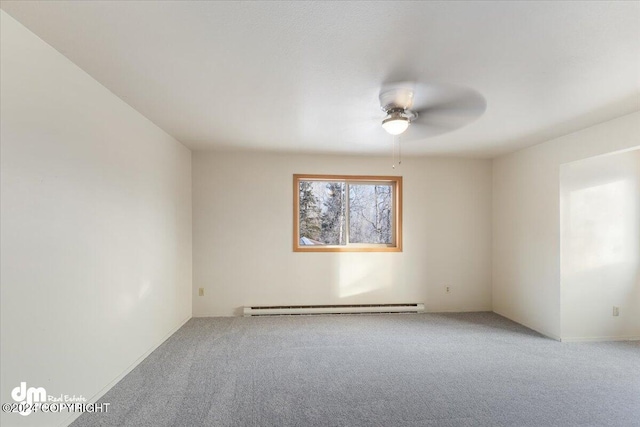 carpeted spare room featuring ceiling fan and a baseboard radiator