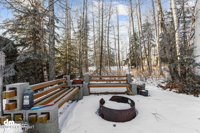 surrounding community featuring an outdoor fire pit