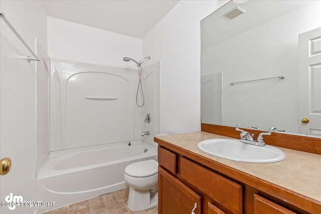 full bathroom featuring shower / bath combination, toilet, and vanity