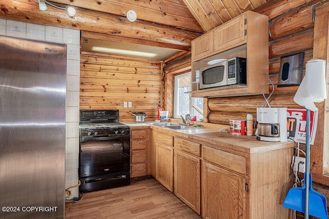 kitchen with sink, vaulted ceiling, light hardwood / wood-style flooring, wood ceiling, and stainless steel appliances