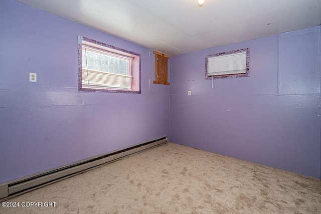 empty room with a baseboard heating unit