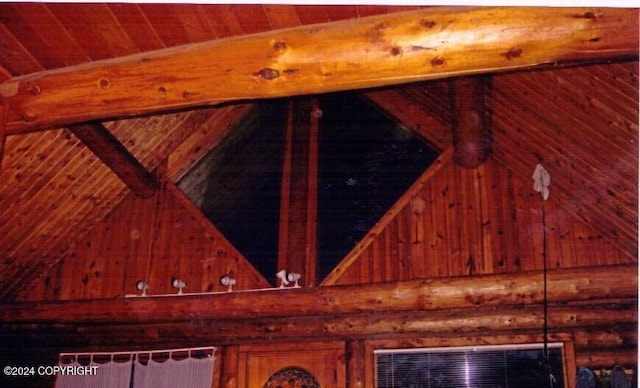 details featuring wood walls, beam ceiling, and wooden ceiling