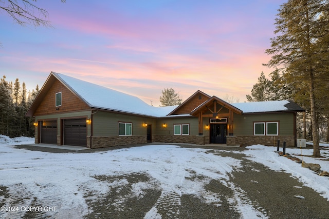 34184 House Dr, Soldotna, AK 99669 - view of front of property featuring stone siding and a garage