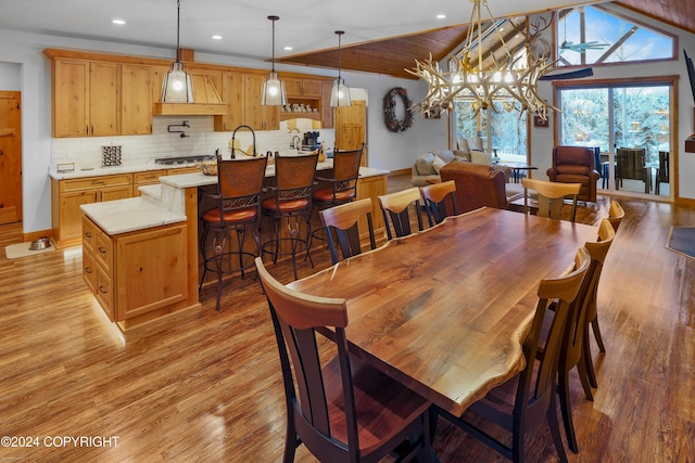 34184 House Dr, Soldotna, AK 99669 - dining room with light wood-style flooring, recessed lighting, a chandelier, and lofted ceiling