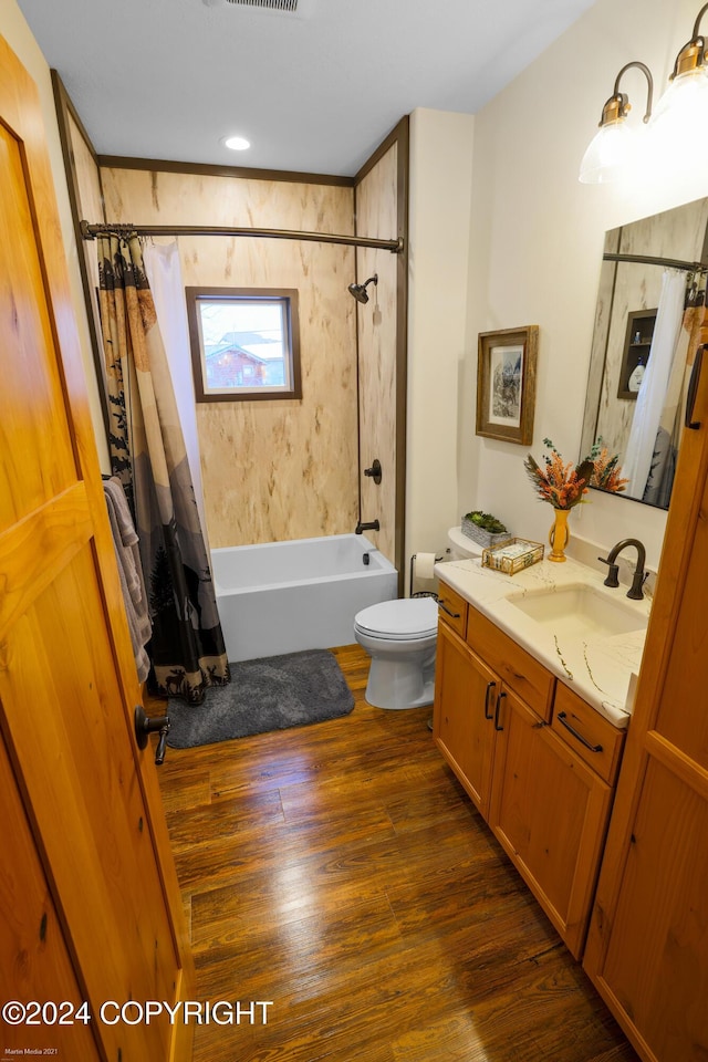 34184 House Dr, Soldotna, AK 99669 - full bathroom featuring shower / bath combo with shower curtain, vanity, toilet, and wood finished floors