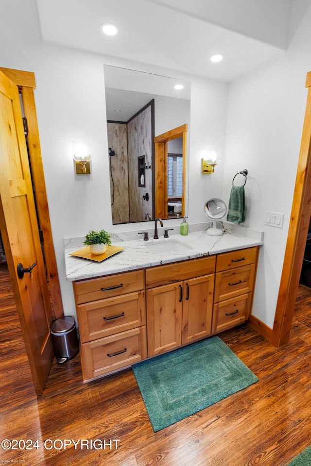 34184 House Dr, Soldotna, AK 99669 - full bathroom with wood finished floors, vanity, baseboards, and recessed lighting