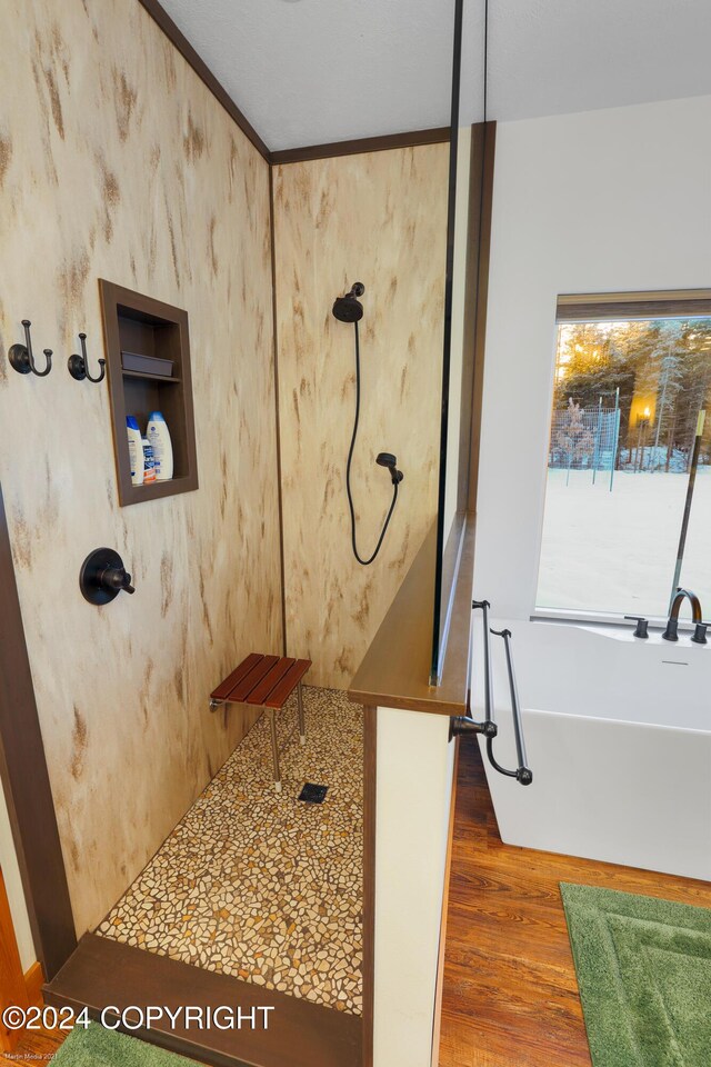34184 House Dr, Soldotna, AK 99669 - full bathroom featuring a freestanding bath, wood finished floors, and a shower