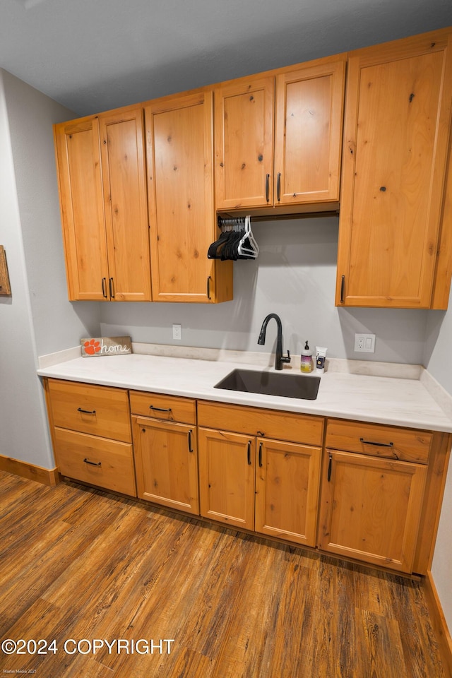 34184 House Dr, Soldotna, AK 99669 - kitchen with a sink, dark wood-style flooring, light countertops, and baseboards