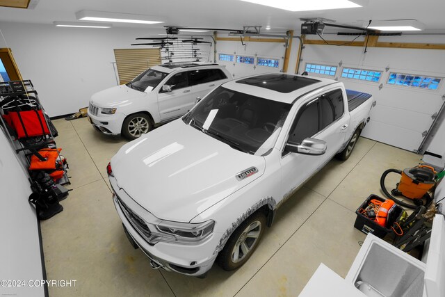 34184 House Dr, Soldotna, AK 99669 - garage featuring a garage door opener