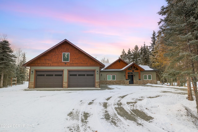 34184 House Dr, Soldotna, AK 99669 - view of front of house with stone siding and a garage