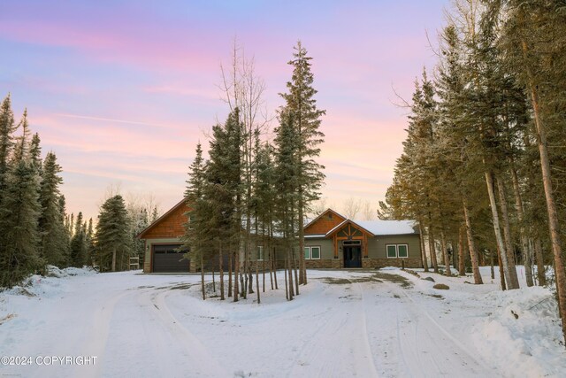 34184 House Dr, Soldotna, AK 99669 - rustic home featuring stone siding and a garage