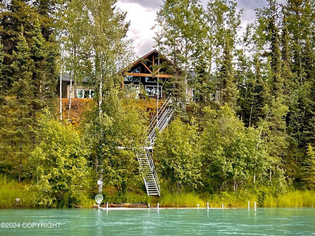 34184 House Dr, Soldotna, AK 99669 - exterior space featuring stairway, a water view, and a view of trees
