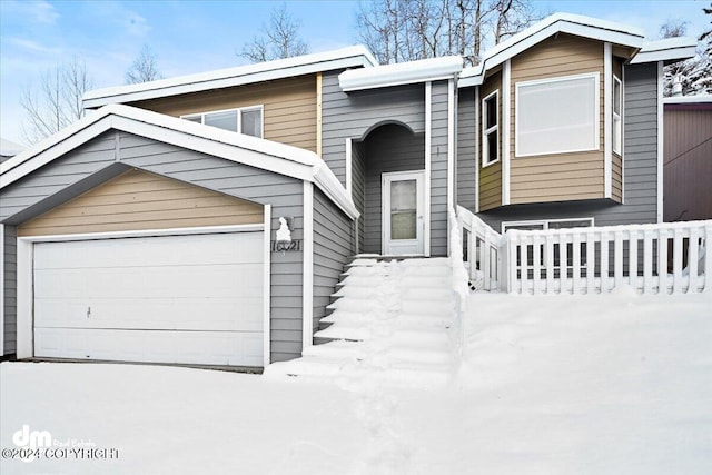 view of front of home with a garage