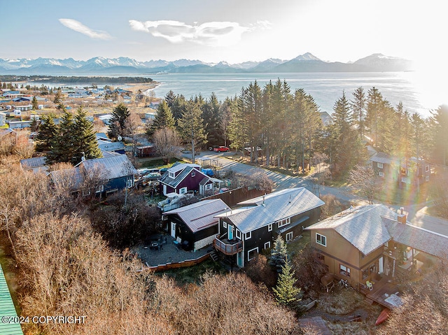 bird's eye view with a water and mountain view