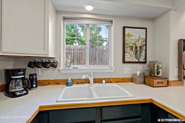 kitchen with sink and white cabinets