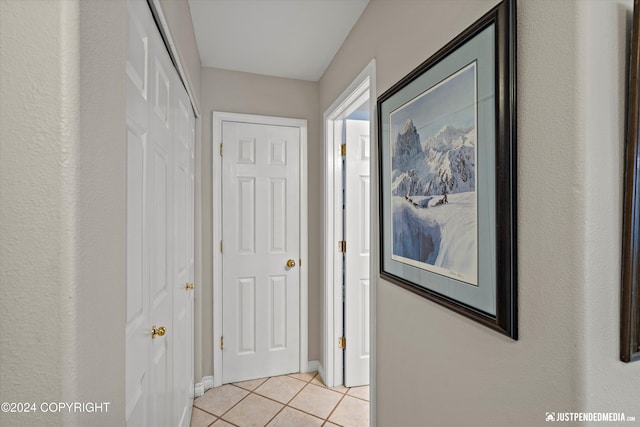 hallway featuring light tile patterned floors