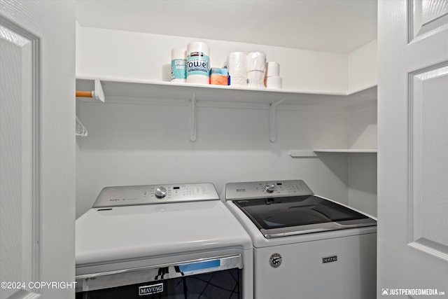 laundry room featuring washing machine and clothes dryer