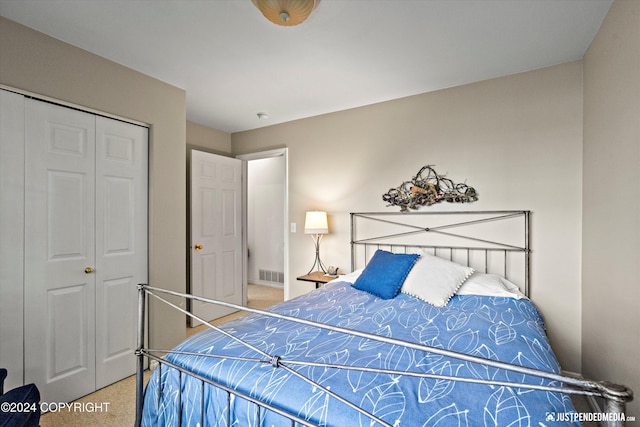 carpeted bedroom with a closet