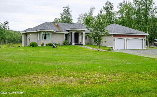 ranch-style house with a garage and a front lawn