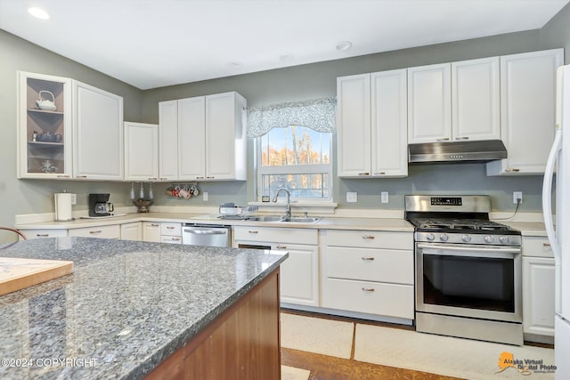 kitchen featuring white cabinetry, sink, and appliances with stainless steel finishes