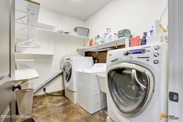 washroom with independent washer and dryer