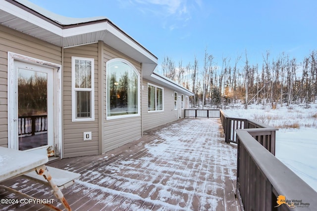 view of snow covered deck