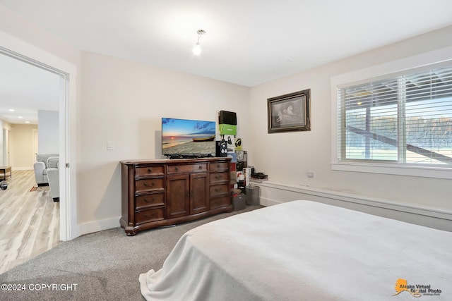 bedroom with light hardwood / wood-style flooring