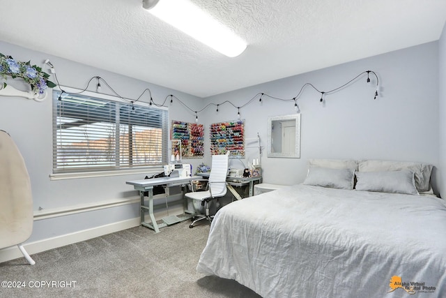 bedroom with carpet and a textured ceiling