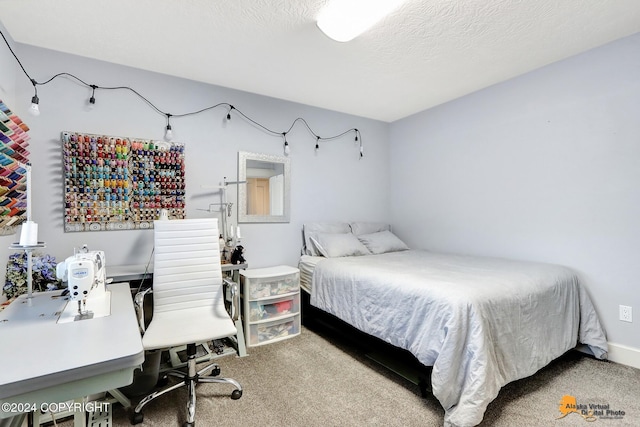 bedroom featuring carpet floors and a textured ceiling