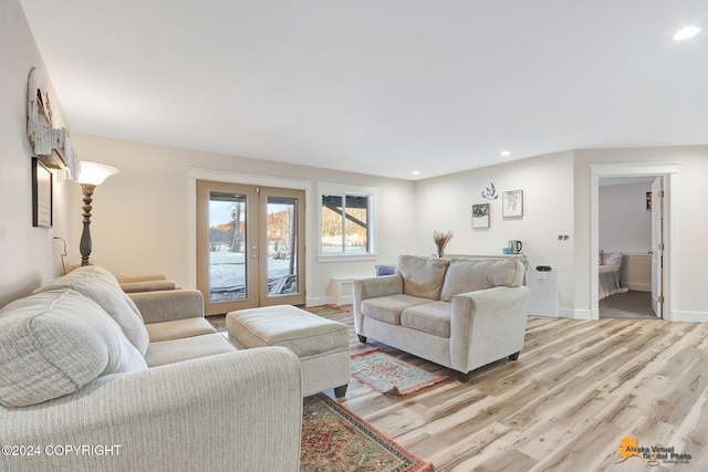 living room featuring french doors and light hardwood / wood-style floors