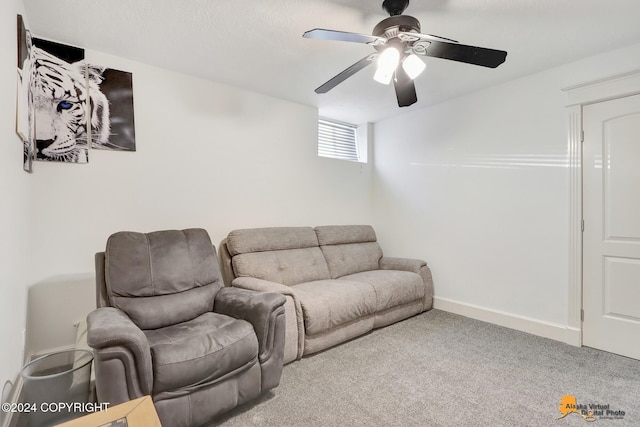 living room with ceiling fan and carpet floors