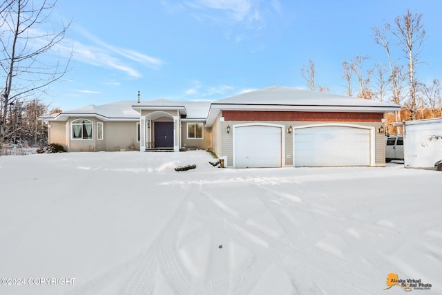 single story home featuring a garage