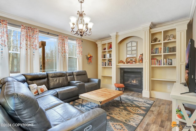 living room with hardwood / wood-style flooring, plenty of natural light, and ornamental molding