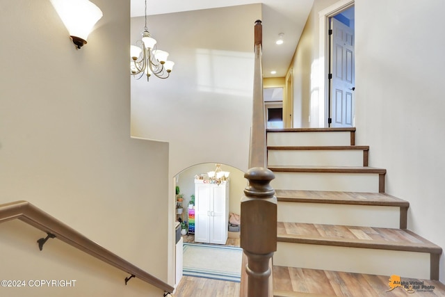 stairs with hardwood / wood-style floors