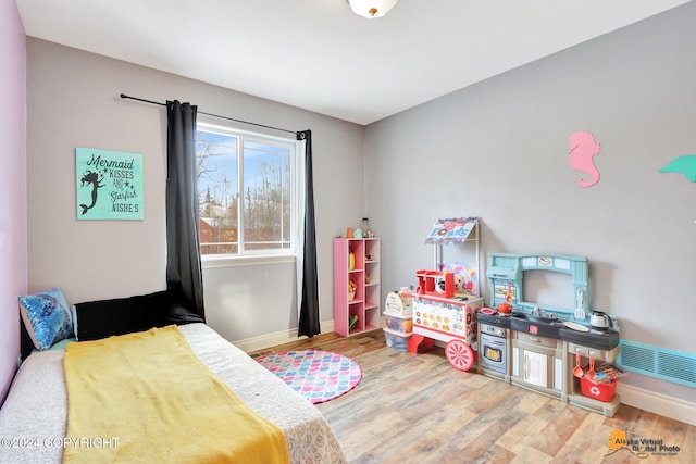 bedroom with wood-type flooring